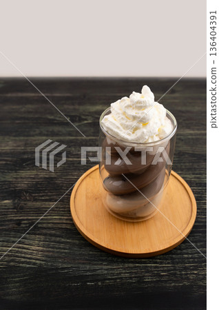 Vertical Hojicha Latte in Sculptural Glass on Neutral Background Vertical Hojicha Latte in Sculptural Glass on Neutral Background 136404391