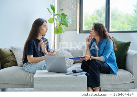 Teenage girl patient in therapy session with social mental therapist 136404454