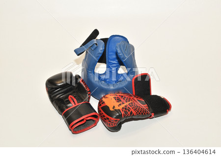 Protective boxing helmet and boxing gloves. 136404614