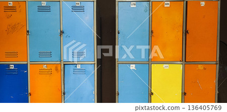 Old metal lockers, colorful, worn, and distressed. Concepts of order, variety, urban space and infrastructure, storage, organization, school or work environments. Old metal lockers, colorful, worn, and distressed. Concepts of order, variety, urban space and infrastructure, storage, organization, school or work environments. 136405769