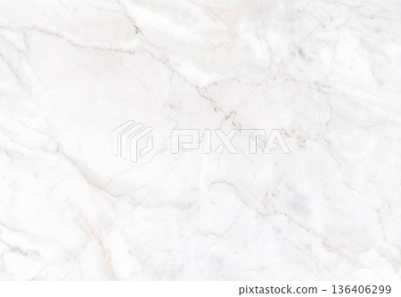 Elegant white marble surface with soft veins glimmering in gentle light 136406299