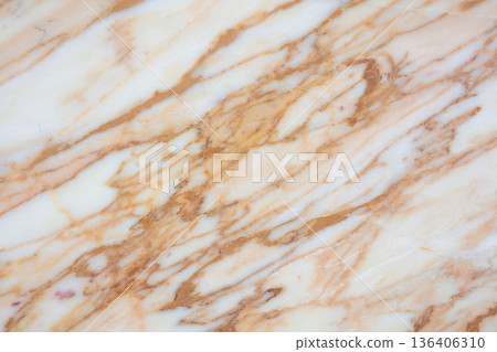 Beautiful marble surface showcasing rich patterns in warm tones from nature's artistry Beautiful marble surface showcasing rich patterns in warm tones from nature's artistry 136406310