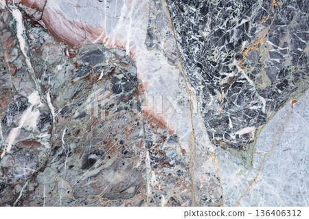 Unique patterns in colorful marble showcase nature's artistry at a stone quarry in the afternoon light 136406312