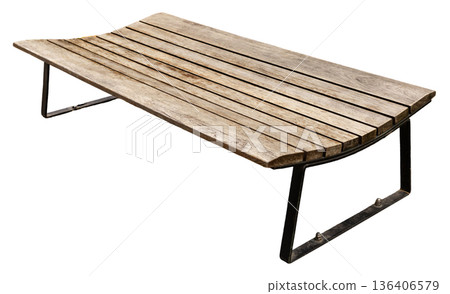 A wooden bench has a curved seat made of slats. Bench features a metal frame with support legs. It is placed on a white background. Public outdoor furniture. 136406579
