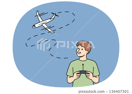 Little boy uses radio-controlled airplane and smiles, rejoicing at appearance of new toy 136407301