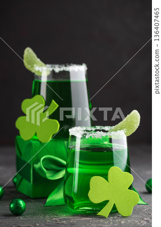 Green Cocktails with Shamrocks and Gifts. Festive St. Patricks Day Celebration Still Life Green Cocktails with Shamrocks and Gifts. Festive St. Patricks Day Celebration Still Life 136407465