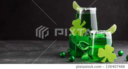 Green Cocktails with Shamrocks and Gifts. Festive St. Patricks Day Celebration Still Life Green Cocktails with Shamrocks and Gifts. Festive St. Patricks Day Celebration Still Life 136407466
