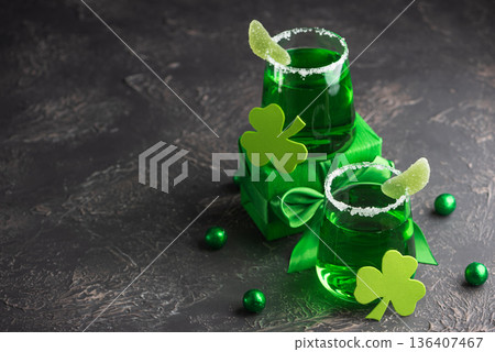 Green Cocktails with Shamrocks and Gifts. Festive St. Patricks Day Celebration Still Life Green Cocktails with Shamrocks and Gifts. Festive St. Patricks Day Celebration Still Life 136407467