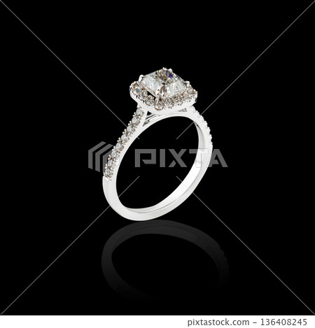 Beautiful white gold ring with diamonds on a black background Beautiful white gold ring with diamonds on a black background 136408245