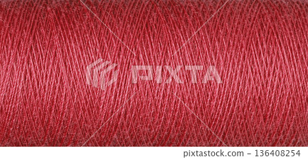 macro texture of a skein of red sewing thread macro texture of a skein of red sewing thread 136408254