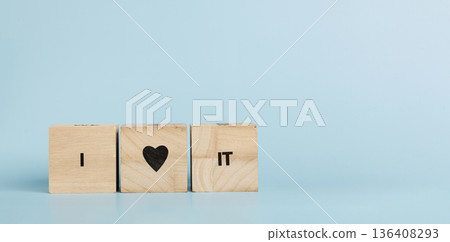 Wooden cubes with inscriptions I Love It on a blue background 136408293
