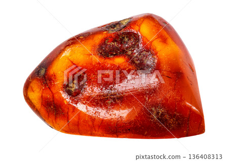 Amber mineral stone on white background 136408313