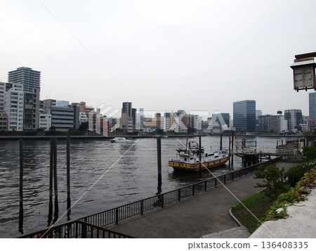 Tsukudajima's downtown atmosphere intersects with modern buildings in this urban landscape Tsukudajima's downtown atmosphere intersects with modern buildings in this urban landscape 136408335