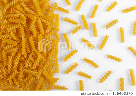 Pasta products in the form of a spiral, texture, on a white background Pasta products in the form of a spiral, texture, on a white background 136408370