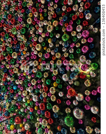 Colorful Christmas ornaments wall with festive lights background 136408453