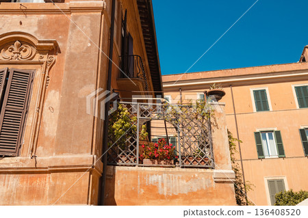 Traditional Italian balcony on historic building in Rome 136408520