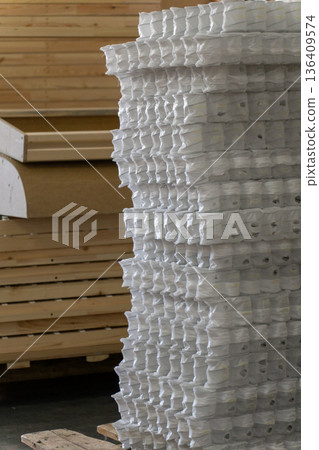Furniture manufacturing factory interior with a stack of wooden frame Furniture manufacturing factory interior with a stack of wooden frame 136409574
