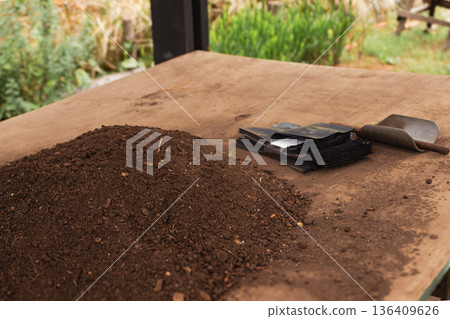 Preparing soil and planting bags for reforesting, promoting sustainable agriculture and environmental care Preparing soil and planting bags for reforesting, promoting sustainable agriculture and environmental care 136409626