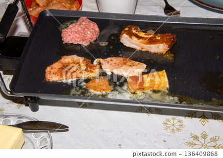 A gourmet sheet pan with crispy meat 136409868