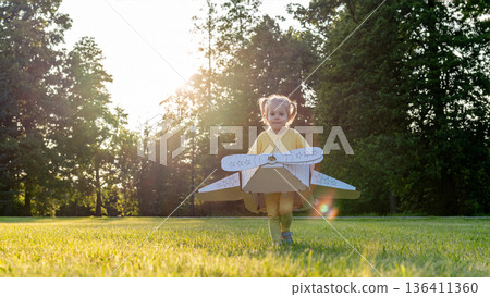 Pretend play child. Girl aviation pilot toy. Summer fun outdoor cardboard. 136411360