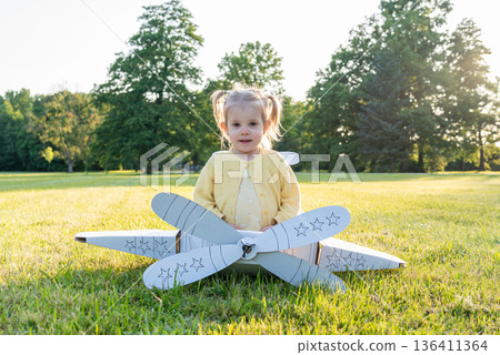 Pilot adventure. Girl flying airplane child. Cardboard costume imagination park. Pilot adventure. Girl flying airplane child. Cardboard costume imagination park. 136411364
