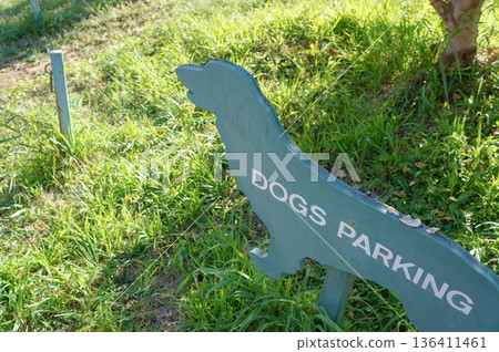 Blue signs indicating dog parking spaces Blue signs indicating dog parking spaces 136411461