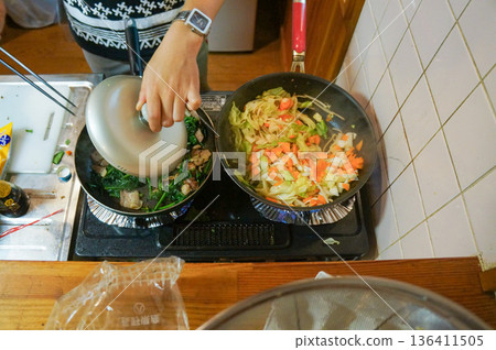 Preparing home-cooked meals in the kitchen 136411505