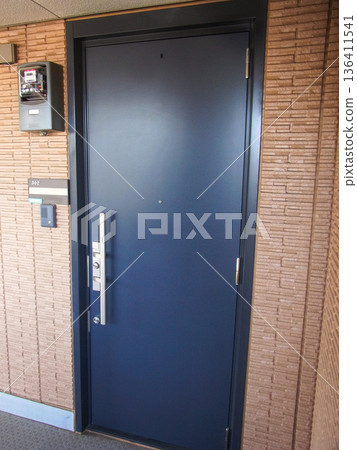The entrance to the apartment building features a distinctive black front door The entrance to the apartment building features a distinctive black front door 136411541