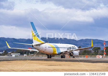 Sendai Airport in winter, airplane taxiing, Natori City, Miyagi Prefecture 136411549