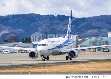 Sendai Airport in winter, airplane taxiing, Natori City, Miyagi Prefecture 136411550