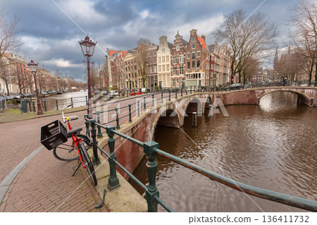 Traditional Canal Houses with Bicycles in Amsterdam, Netherlands Traditional Canal Houses with Bicycles in Amsterdam, Netherlands 136411732