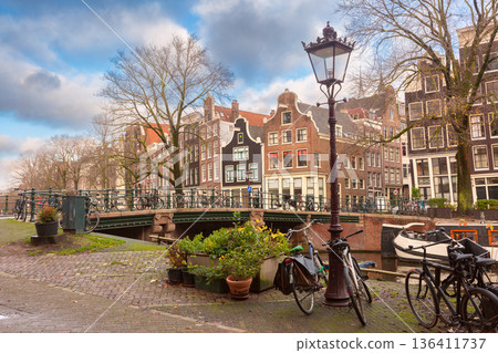 Traditional Canal Houses with Bicycles in Amsterdam, Netherlands 136411737