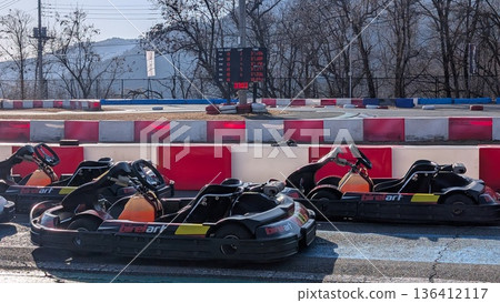 Go-karts lined up on the circuit 136412117