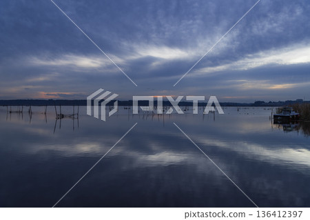 Clouds appearing on the surface of the water Clouds appearing on the surface of the water 136412397