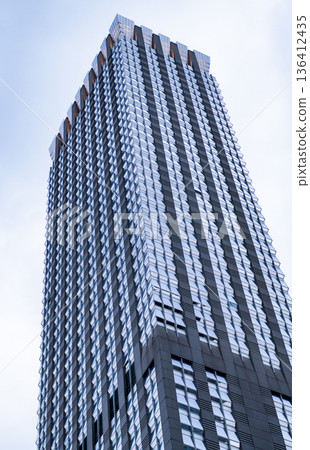 Skyscraper building architecture. Skyscraper in business district. Modern building in metropolis city. Business building skyscraper in city. City downtown with skyscraper. Architecture design Skyscraper building architecture. Skyscraper in business district. Modern building in metropolis city. Business building skyscraper in city. City downtown with skyscraper. Architecture design 136412435