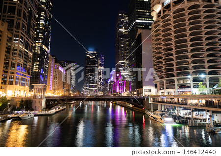 Skyscraper cityscape. Night city of Chicago. Business city. Night cityscape of Chicago skyscraper building. Chicago architecture of skyscraper. City night illuminated building. Lakefront glow Skyscraper cityscape. Night city of Chicago. Business city. Night cityscape of Chicago skyscraper building. Chicago architecture of skyscraper. City night illuminated building. Lakefront glow 136412440
