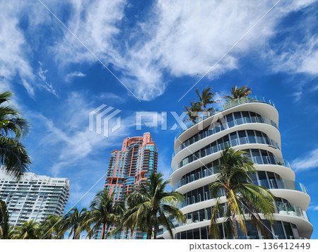 Architectural building in Miami beach. Skyscraper perspective view. Hotel architecture. Architecture modern building. Perspective residential skyscraper. Modern skyscraper building. Summer vacation 136412449