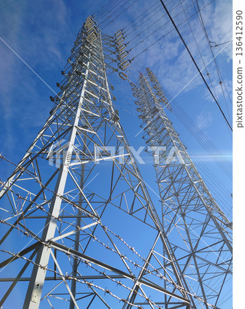 High voltage tower / A high voltage electricity tower that stands out against the blue sky High voltage tower / A high voltage electricity tower that stands out against the blue sky 136412590