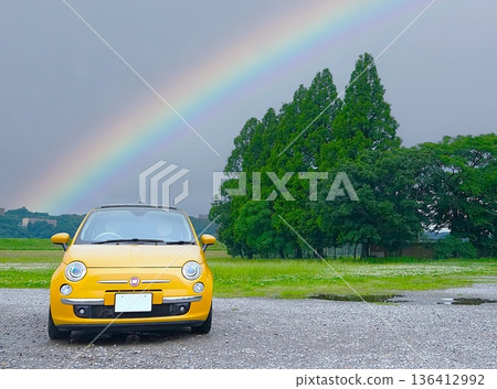 Rainbow and yellow Italian car in rainy season Rainbow and yellow Italian car in rainy season 136412992
