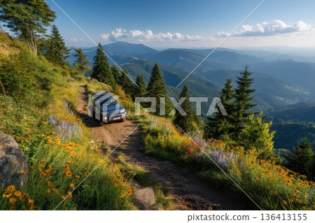 Vibrant Summer Landscape with Colorful Flowers and Car in Scenic Mountain Environment Vibrant Summer Landscape with Colorful Flowers and Car in Scenic Mountain Environment 136413155