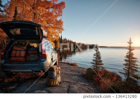 Scenic SUV Adventure at Lakeside with Camping Gear in Autumn Landscape Scenic SUV Adventure at Lakeside with Camping Gear in Autumn Landscape 136413280