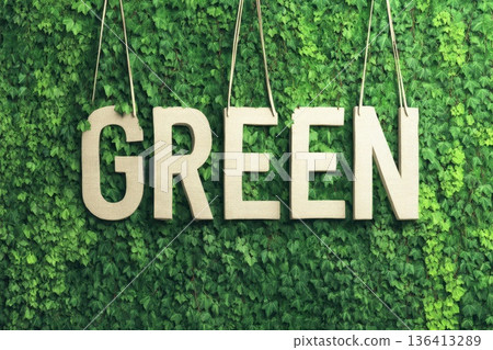 Eco-Friendly Tote Bag with Go Green Slogan Hanging on Lush Green Background Eco-Friendly Tote Bag with Go Green Slogan Hanging on Lush Green Background 136413289