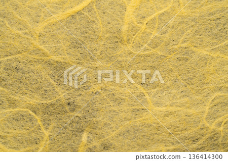Textured background of a close-up of the yellow Japanese paper surface Textured background of a close-up of the yellow Japanese paper surface 136414300