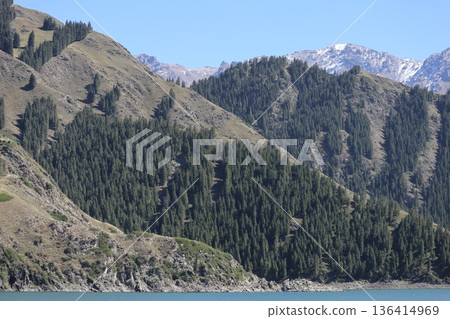 Traveling along the Silk Road in China: Scenery of Tianshan Tianchi in Urumqi Traveling along the Silk Road in China: Scenery of Tianshan Tianchi in Urumqi 136414969