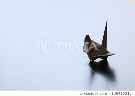 Folded paper crane 136415212
