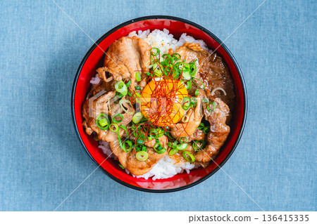 Pork bowl topped with egg yolk Pork bowl topped with egg yolk 136415335