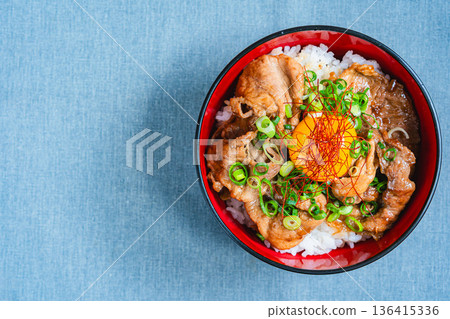 Pork bowl topped with egg yolk Pork bowl topped with egg yolk 136415336