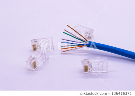 Blue LAN cable Cat6 with eight inner wires visible, network cable core showing twisted copper lines inside Blue LAN cable Cat6 with eight inner wires visible, network cable core showing twisted copper lines inside 136416375