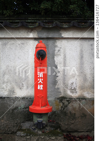 Red fire hydrant at a tourist spot Red fire hydrant at a tourist spot 136416727