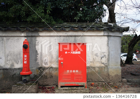 Red fire hydrant at a tourist spot Red fire hydrant at a tourist spot 136416728
